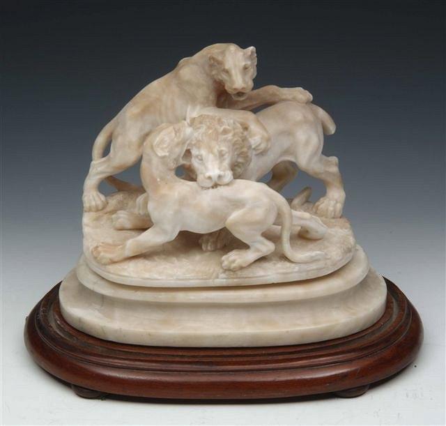 Appraisal: AN ALABASTER MODEL OF THREE LIONS FIGHTING on a alabaster