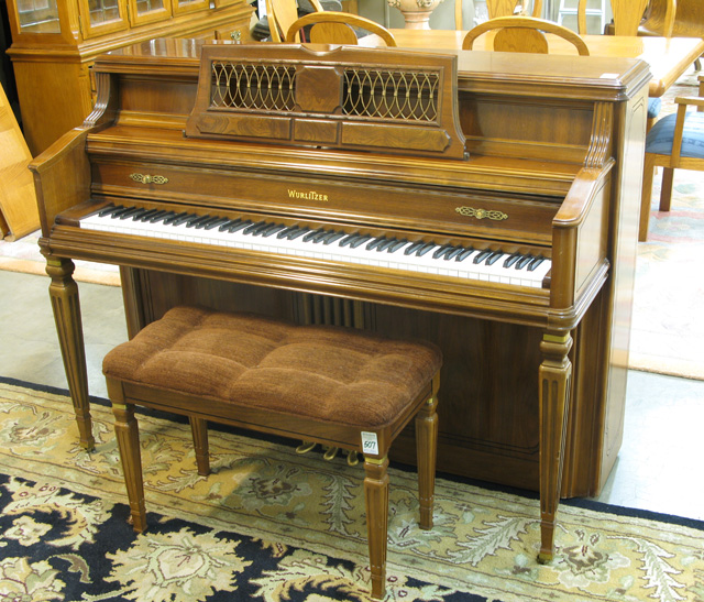 Appraisal: CONSOLE PIANO WITH MATCHING BENCH The Wurlitzer Co model serial