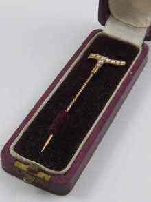 Appraisal: A yellow metal tests ct gold stick pin in the