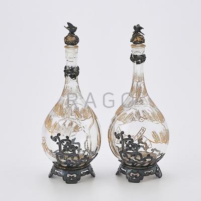 Appraisal: TWO SILVER MOUNTED CUT CRYSTAL SCENT BOTTLES Chinoiserie drop-shaped flasks