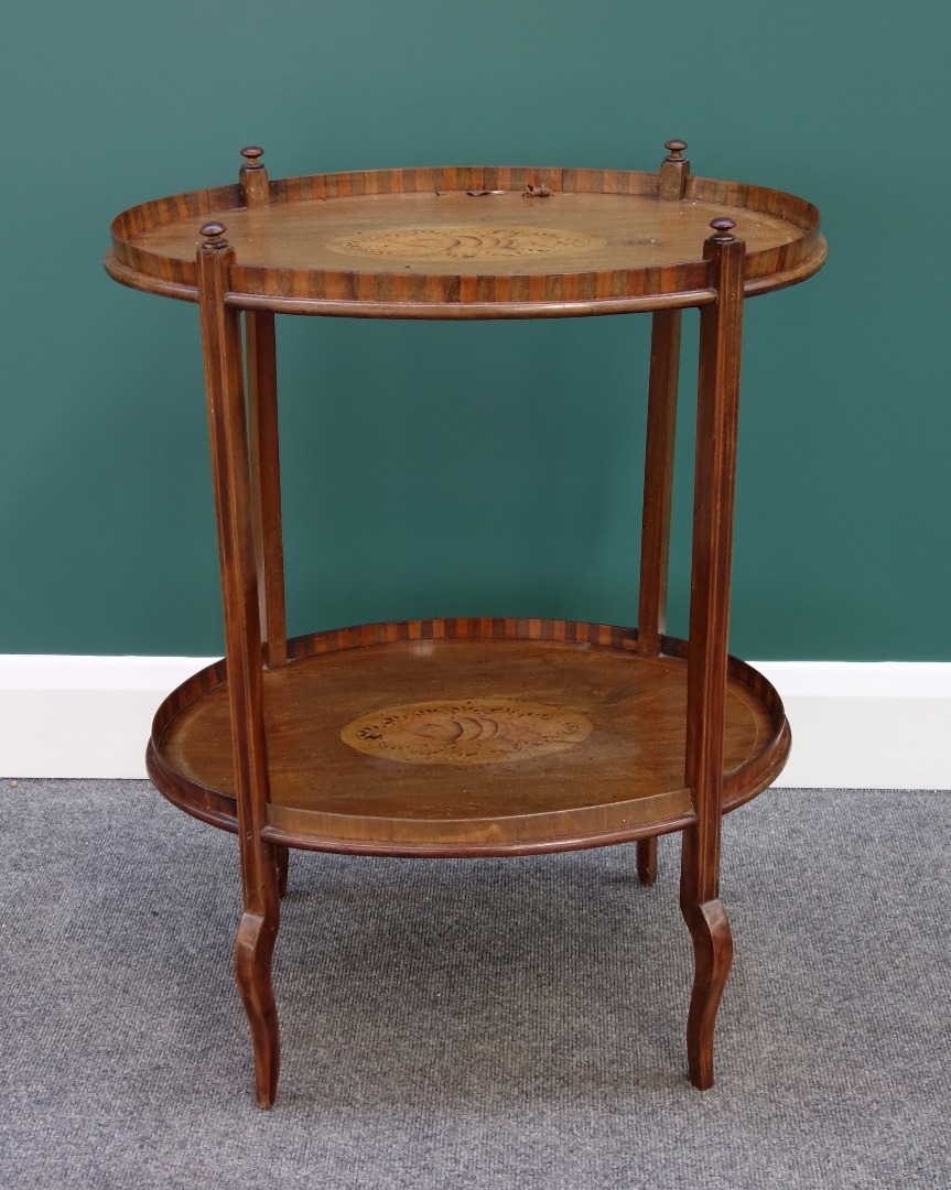 Appraisal: A th century marquetry inlaid mahogany oval two tier etagere