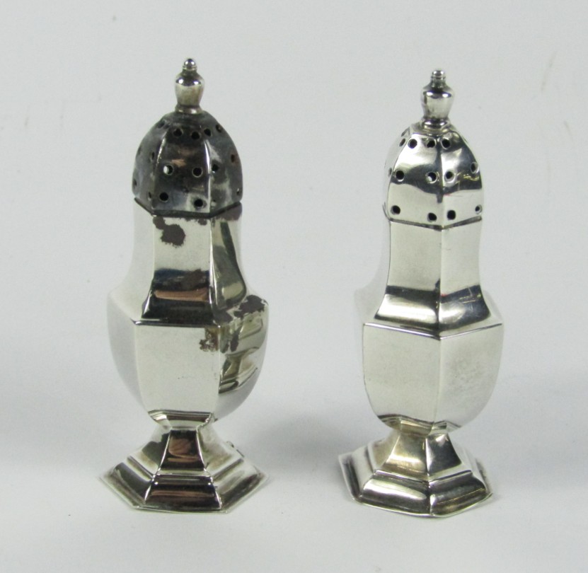 Appraisal: A pair of Victorian silver pepperettes of hexagonal baluster form