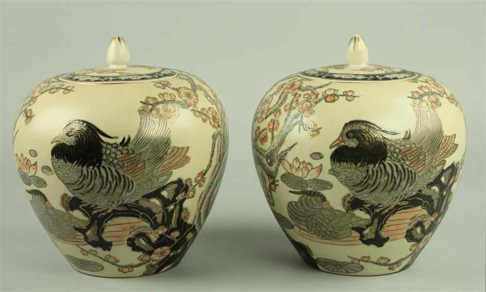 Appraisal: PAIR OF ORIENTAL BUFF GROUND JARS AND COVERS decorated with