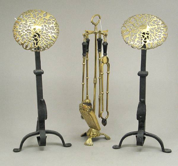 Appraisal: A pair of Baroque style brass and iron andirons and