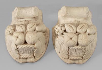 Appraisal: Pair marble mounts baskets of fruit below scrolled pediment probably