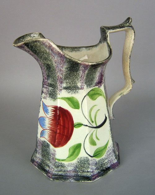 Appraisal: Purple and black rainbow spatter pitcher with tulip decoration h