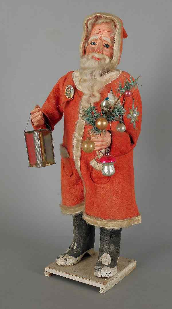 Appraisal: Composition mechanical Santa Claus with feather tree and lantern h