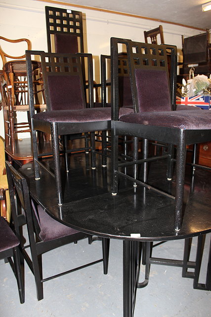 Appraisal: AN EBONISED MACKINTOSH STYLE EXTENDABLE DINING TABLE together with eight