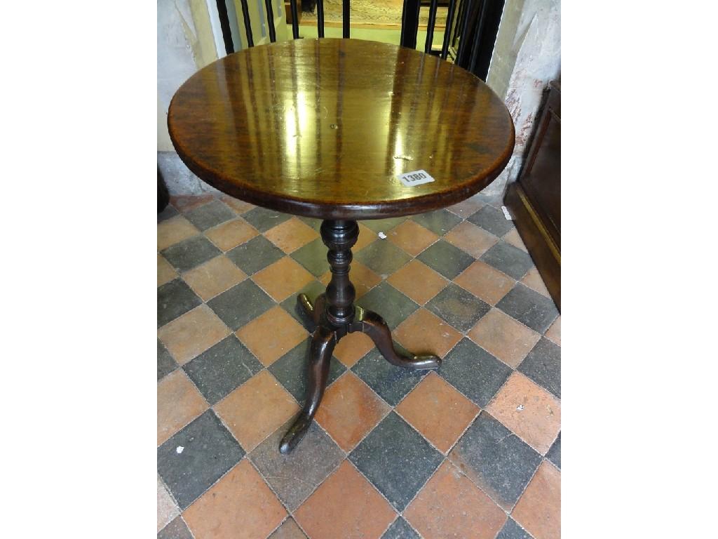 Appraisal: A mahogany occasional table of oval form raised on a