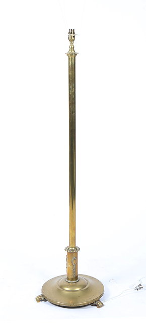 Appraisal: A BRASS LAMP STANDARD with column support and spreading circular