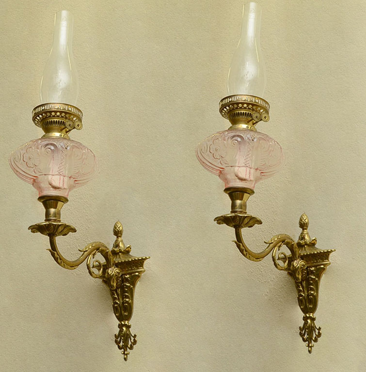 Appraisal: PAIR BRASS RAMS HEAD WALL OIL LAMP SCONCES Victorian cast