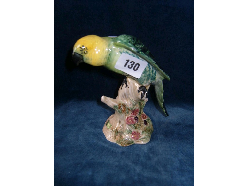 Appraisal: A Beswick model of a green and yellow parrot with