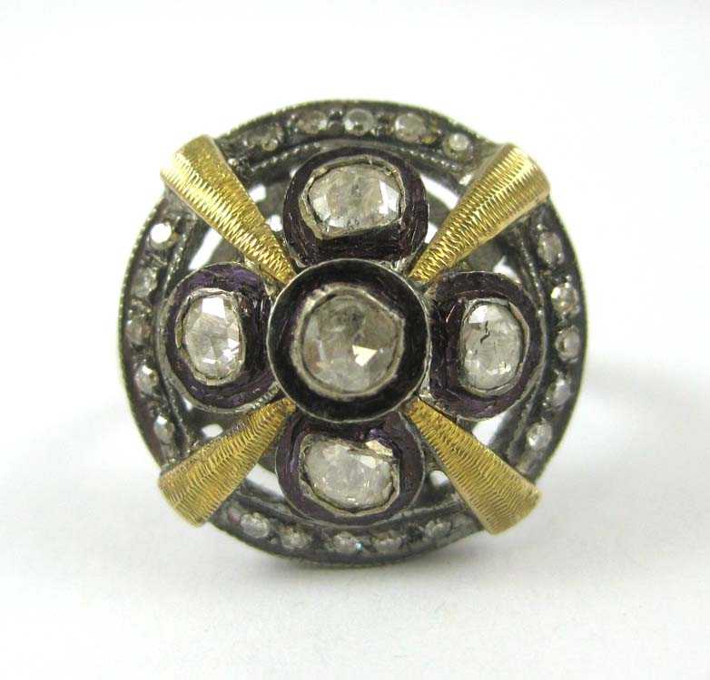 Appraisal: DIAMOND SILVER AND YELLOW GOLD RING The sterling silver and