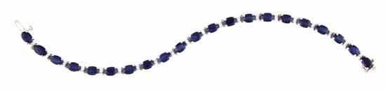 Appraisal: Sapphire and diamond bracelet twenty-one x mm oval deep blue