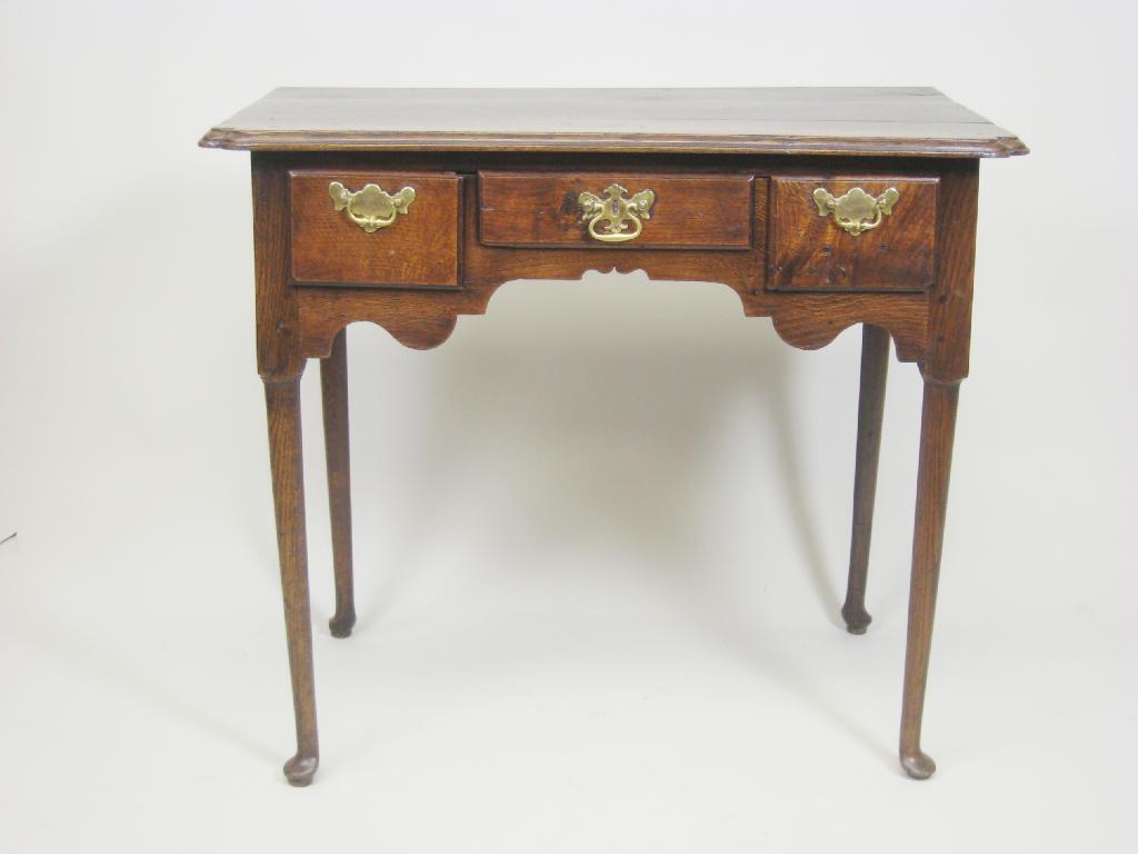 Appraisal: An th Century oak Lowboy having moulded top with re-entrant