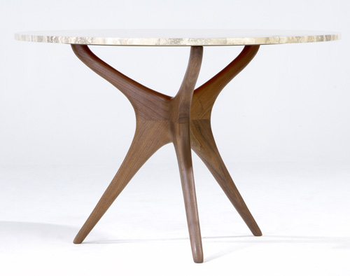 Appraisal: VLADIMIR KAGAN Occasional table with sculpted walnut base and marble