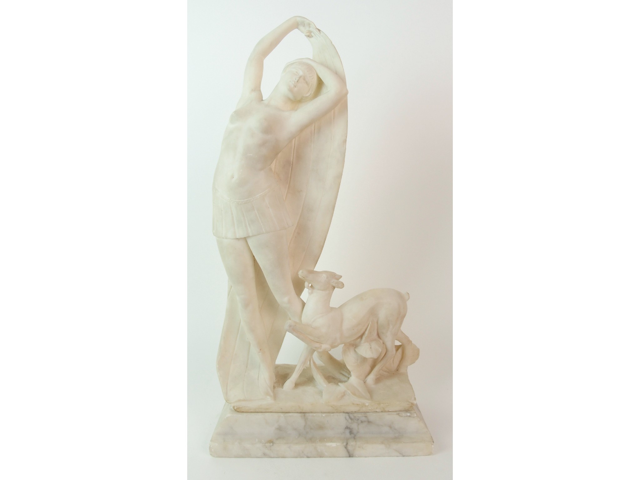 Appraisal: A Continental carved marble figure of Dianadepicting Diana the Huntress