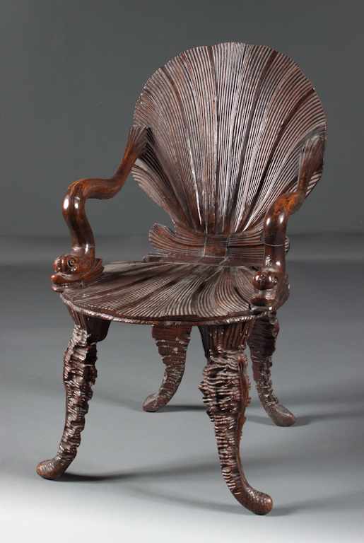 Appraisal: Italian carved walnut grotto chair th century with aldine dolphin