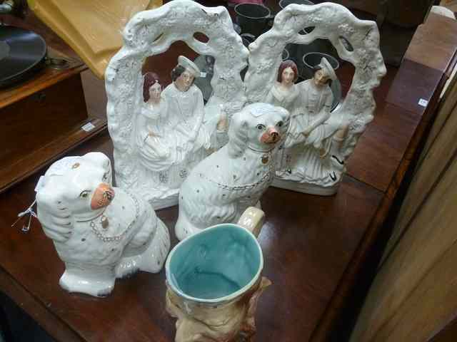 Appraisal: A PAIR OF STAFFORDSHIRE FLAT BACK FIGURES of lovers sitting