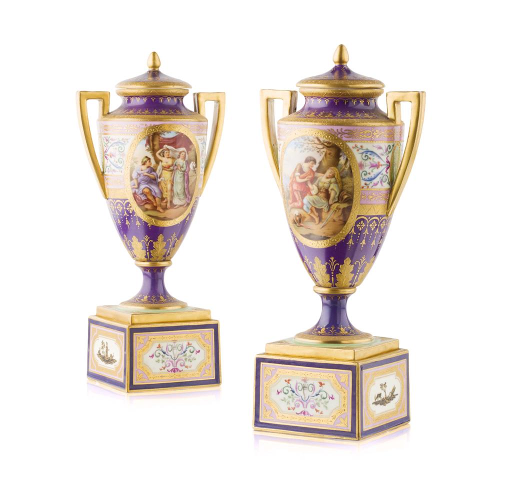 Appraisal: PAIR OF VIENNA PORCELAIN COVERED URNS ON STANDS LATE TH