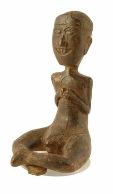 Appraisal: An Indonesian seated male figure with crossed legs and hands