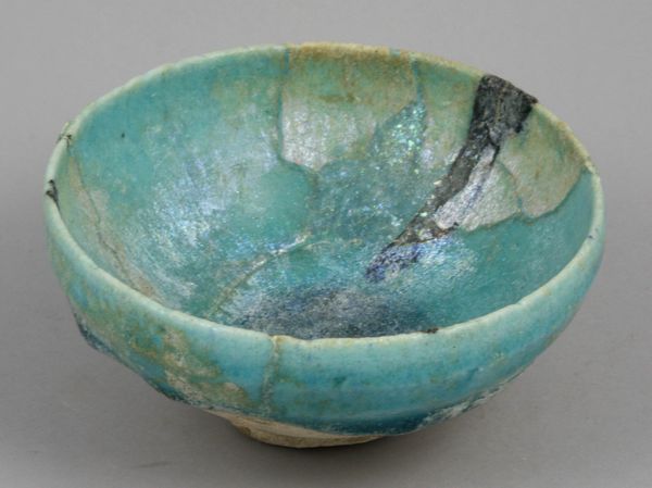 Appraisal: th- th Century Persian grey terracotta bowl having turquoise glaze