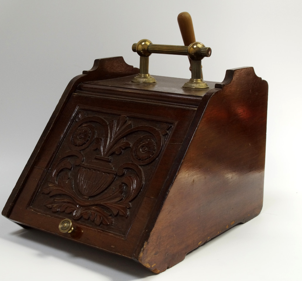 Appraisal: A Victorian mahogany coal scuttle with brass handle and shovel