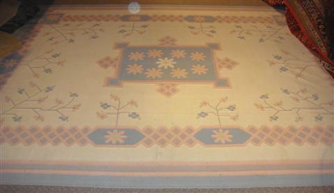 Appraisal: DHURRIE CREAM FLORAL RUG WITH PEACH AND BLUE BORDER x