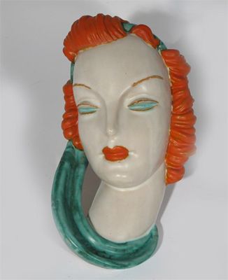 Appraisal: Goldscheider' a terracotta wall mask model no glazed in colours