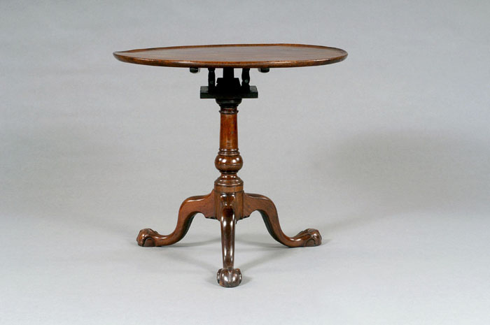 Appraisal: PHILADELPHIA CHIPPENDALE CARVED WALNUT TILT-TOP BIRDCAGE TEA TABLE The circular