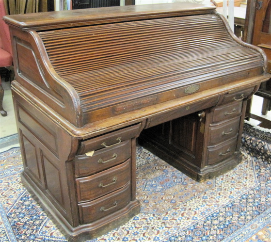 Appraisal: AN ANTIQUE MAHOGANY ROLL-TOP DESK The Rand Leopold Desk Co