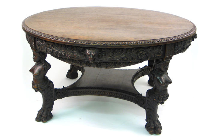 Appraisal: ROUND CARVED OAK DINING TABLE Renaissance Revival th century The