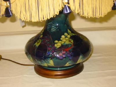 Appraisal: A MOORCROFT POTTERY TABLE LAMP of squat baluster form tube