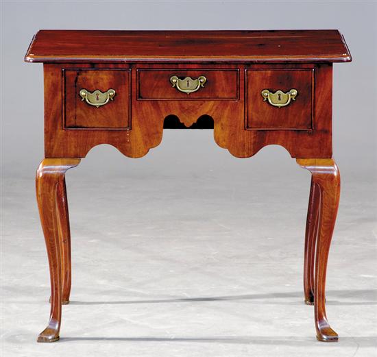 Appraisal: Georgian walnut lowboy early th century rectangular molded top over