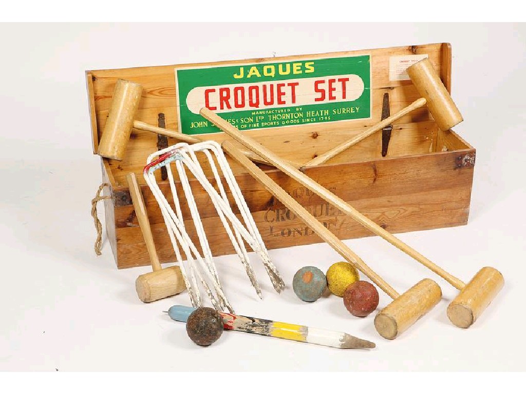 Appraisal: A JAQUES CROQUET SET comprising mallets hoops and balls in