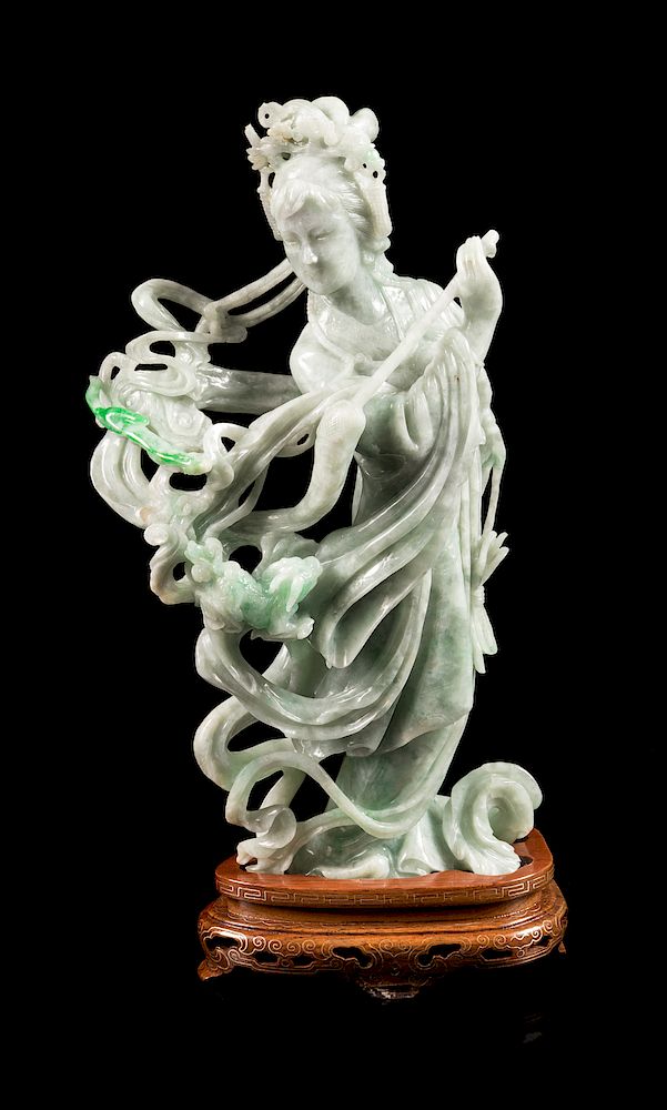 Appraisal: A Chinese Apple Green and Pale Celadon Jadeite Figure of