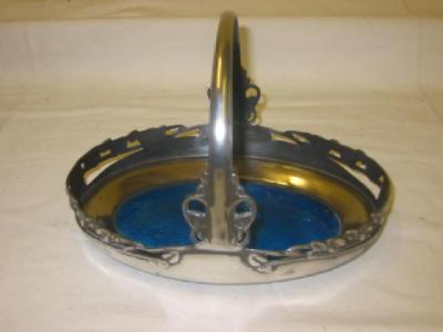 Appraisal: A TUDRIC PEWTER ENAMEL BASKET of oval form with loop