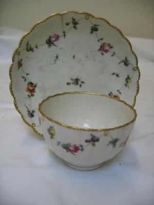 Appraisal: A CHELSEA DERBY PORCELAIN RIBBED TEA BOWL AND SAUCER painted