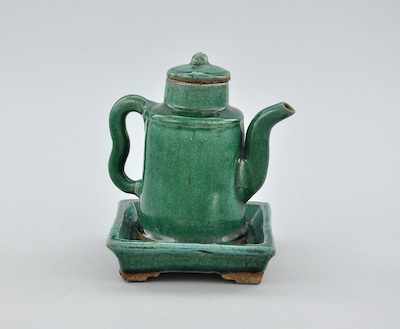 Appraisal: A Chinese Green Glazed Stoneware Teapot and Liner Plate Round