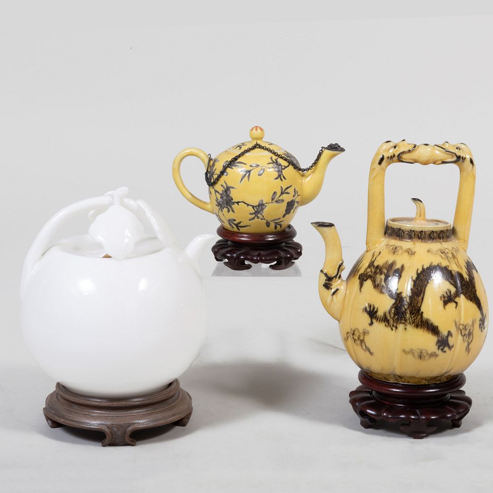 Appraisal: Three Chinese Porcelain Wine Pots Comprising A white glazed pot