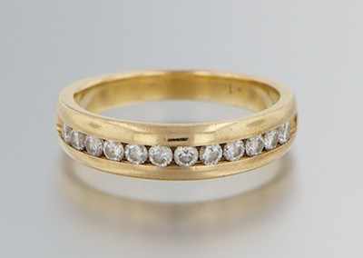 Appraisal: A Ladies' Diamond Band k yellow gold band with channel