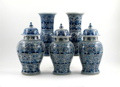 Appraisal: A Dutch Delft garniture of three vases and covers and