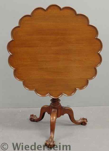 Appraisal: Chippendale style walnut tea table with a carved shaped top