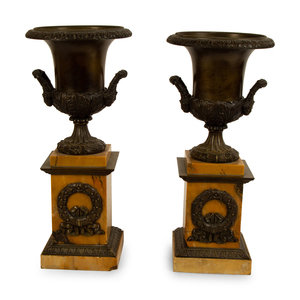 Appraisal: A Pair of French Bronze Urns on Marble Bases TH