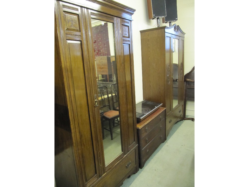 Appraisal: Two Edwardian mirror door wardrobes and a chest of drawers