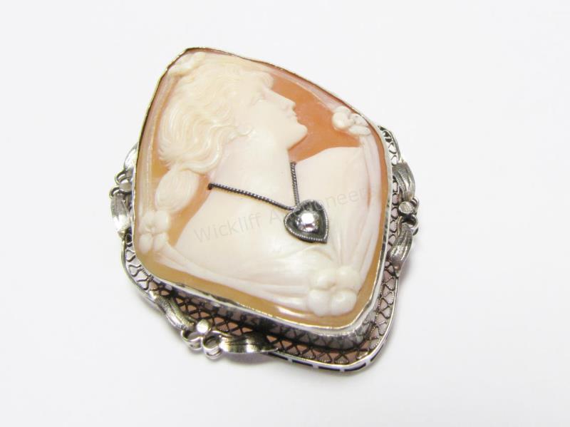 Appraisal: A K white gold cameo pin pendant in ornamental filigree