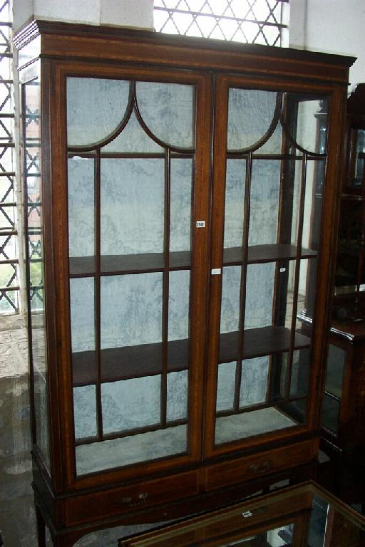 Appraisal: An inlaid Edwardian mahogany china display cabinet of full height