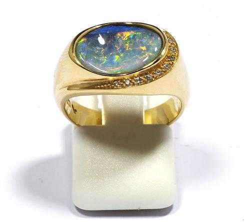 Appraisal: OPAL AND BRILLIANT-CUT DIAMOND RING Yellow gold Casual-elegant ring the