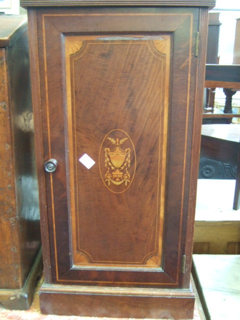 Appraisal: A late th century inlaid mahogany pot cupboard resting on