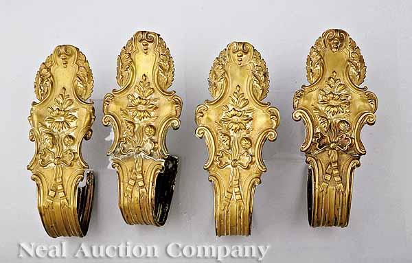 Appraisal: A Set of Four Victorian Gilt and Pressed Brass Cartouche